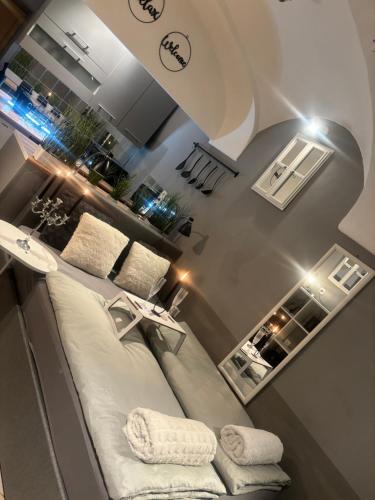 a room with a bed and a large mirror at Studio Old Town in Maribor