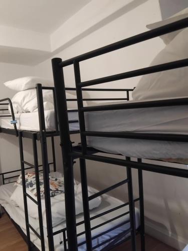 a couple of bunk beds in a room at Bell House Hostel in London