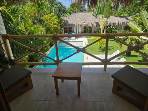 a view from the balcony of a resort with a pool at Casa Shambala B&B in Las Terrenas