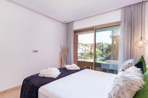 Ένα ή περισσότερα κρεβάτια σε δωμάτιο στο Alma Prestigia Appartments