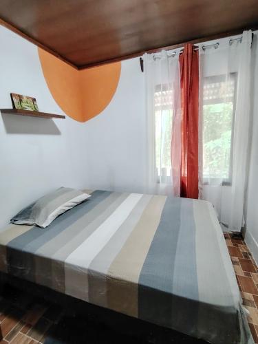 Una cama o camas en una habitación de Casa Cristy