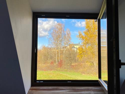 a window in a room with a view of a yard at Dom w krainie Bugu in Korczew