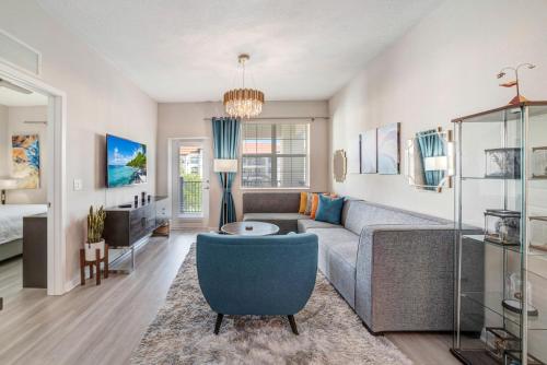 a living room with a couch and a table at Luxury 3BR resort Condo walking distance to Epic Universe, Convention center and Icon Park in Orlando