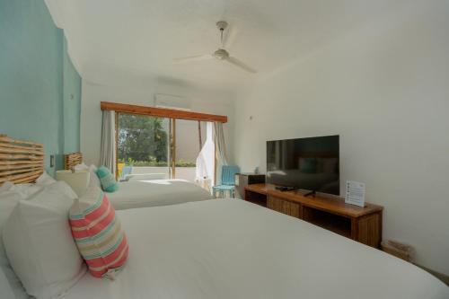 Μια τηλεόραση ή/και κέντρο ψυχαγωγίας στο Hotel Amaca Puerto Vallarta - Adults Only