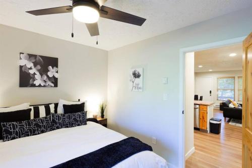 a bedroom with a bed and a ceiling fan at Luxuriously Contemporary Condo in Eden