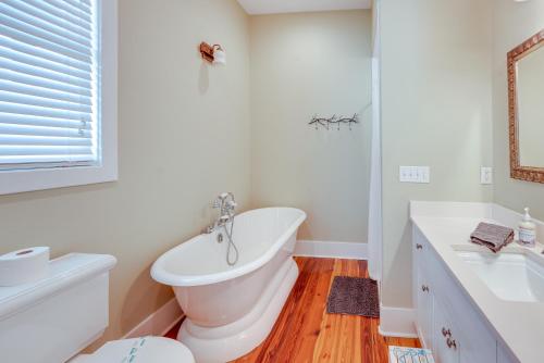 a white bathroom with a toilet and a sink at Beach and Pool Access Peaceful St Teresa House in Big Blackjack Landing