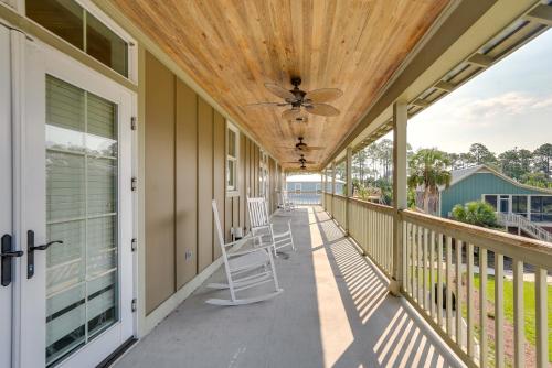 a covered porch with chairs and a ceiling at Beach and Pool Access Peaceful St Teresa House in Big Blackjack Landing