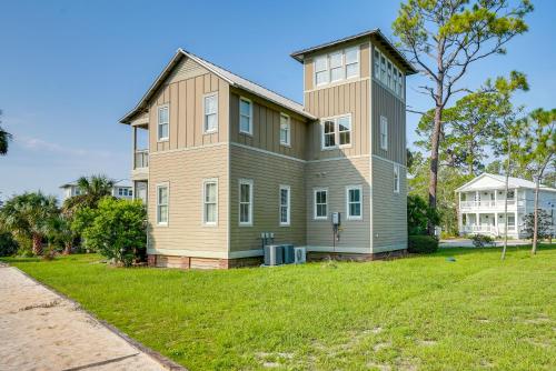 a large house on a grassy field with a building at Beach and Pool Access Peaceful St Teresa House in Big Blackjack Landing