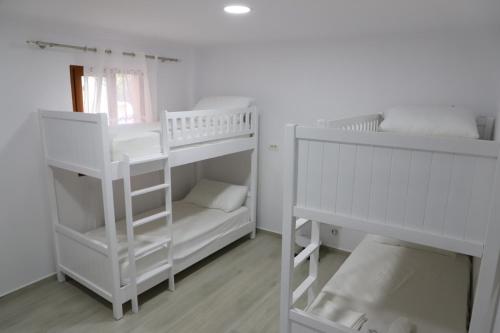 Postel nebo postele na pokoji v ubytování Aral Hostel