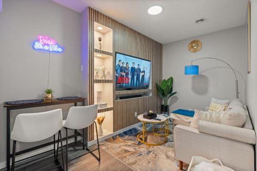 a living room with a couch and a table at Meriweather - Calgary Breathtaking 1-bedroom apartment in Calgary