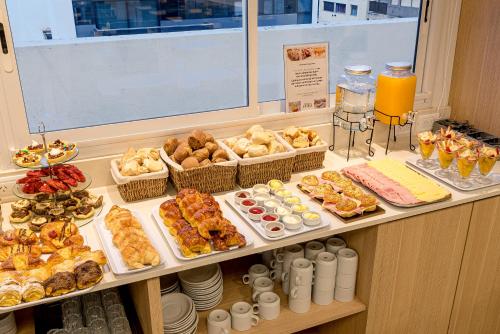 a buffet with many different types of food on display at Hotel Traful in Mar del Plata