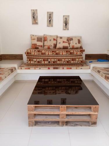a room filled with lots of pieces of art on display at Villa chez ibou somone in Somone