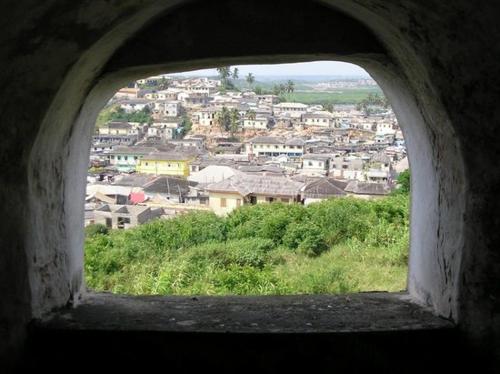 a view of a city from a window at Purple Springs Elmina #1 in Esamang