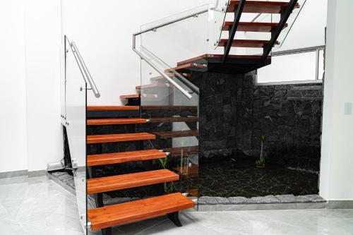 a staircase in a house with a bench at Home 333 habitacion 336 in Escazu
