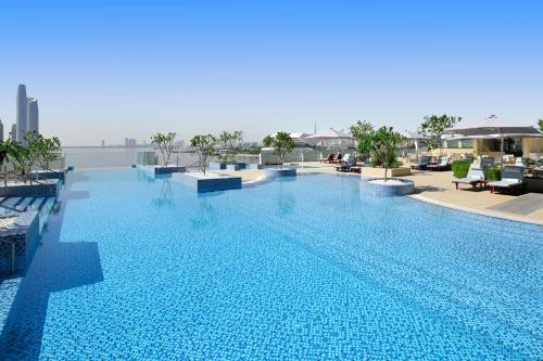 a large swimming pool on top of a building at InterContinental Dubai Festival City by IHG in Dubai