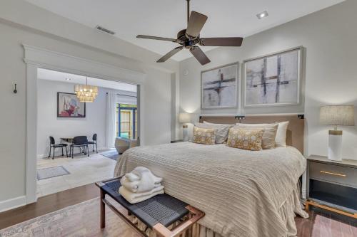 a bedroom with a large bed and a ceiling fan at The Lincoln Loft, Near Forsyth Park with Free Parking in Savannah