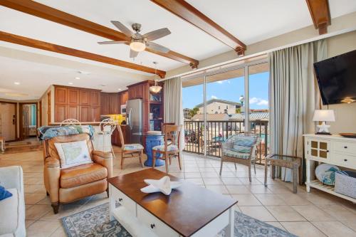 a living room with a couch and a tv at 3 Bed Condo Block to Beach 2 Pools Hot Tub in Tybee Island