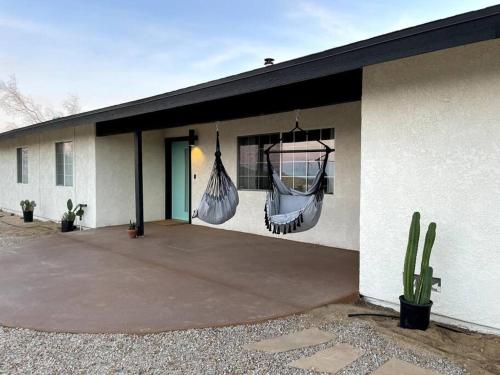 a building with a patio with a cactus at Private retreat close to JTNP and downtown in Joshua Tree