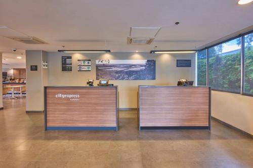 an office with a reception desk in a building at City Express by Marriott Hermosillo Expo in Hermosillo