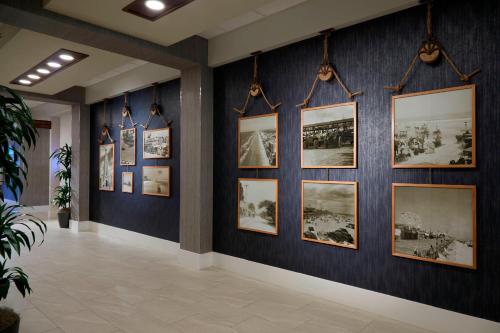 a room with pictures on the wall at Delta Hotels by Marriott Daytona Beach Oceanfront in Daytona Beach