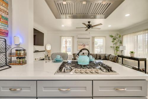 a kitchen with a stove with a tea kettle on it at 2 Mi to SoFi Stadium Updated Inglewood Home! in Los Angeles