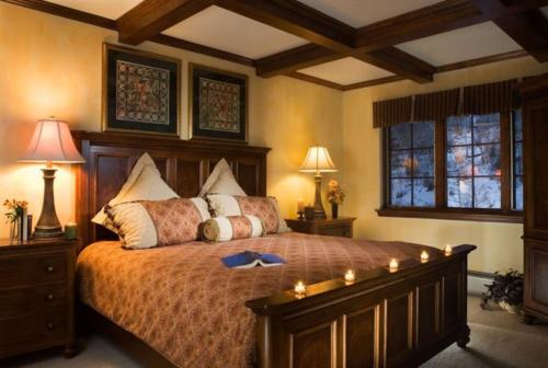 a bedroom with a large bed and two windows at Beaver Creek St James 4 Bedroom in Beaver Creek