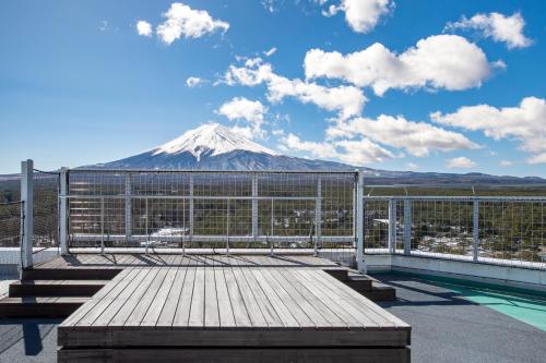 a view of a snow covered mountain from a balcony at Highland Resort Hotel & Spa in Fujiyoshida