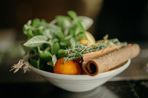 a bowl of fruit and vegetables on a table at JW Marriott Jeju Resort & Spa in Seogwipo