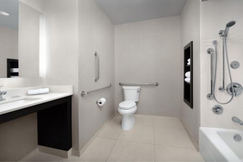 a bathroom with a toilet and a sink and a shower at Residence Inn by Marriott Fresno Clovis in Clovis