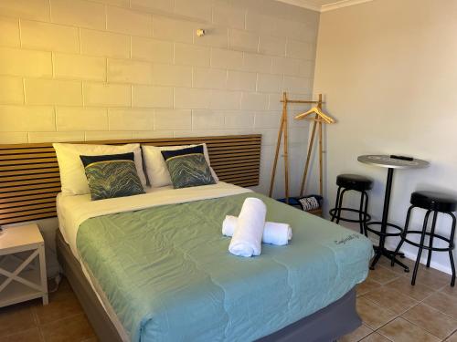 Ένα ή περισσότερα κρεβάτια σε δωμάτιο στο Innisfail Riverfront Motel