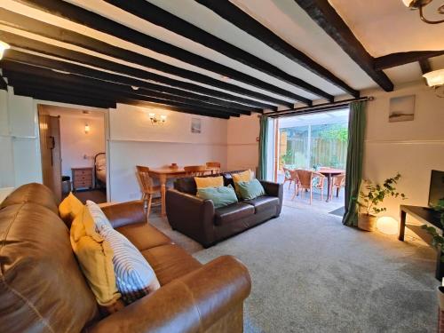 a living room with a couch and a table at Fernhurst holiday apartments in Shanklin