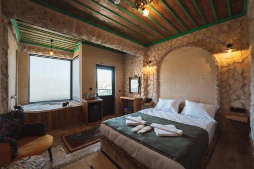 Postel nebo postele na pokoji v ubytování Muse Cappadocia