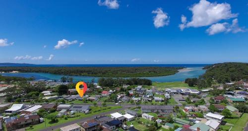 an aerial view of a town with a hot air balloon at Bright and Breezy in Sussex inlet
