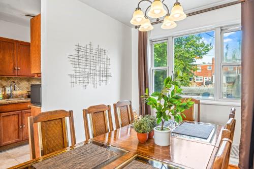 a kitchen and dining room with a table and chairs at --Free Parking & 2 King Beds -- Vintage Retreat -- Floyd's Freedom in Alexandria