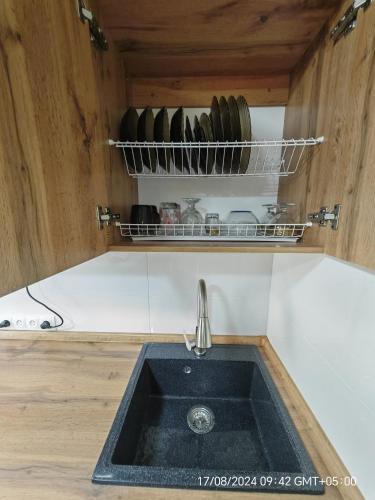 a sink in a kitchen with a sink at Квартира LUX in Balqash