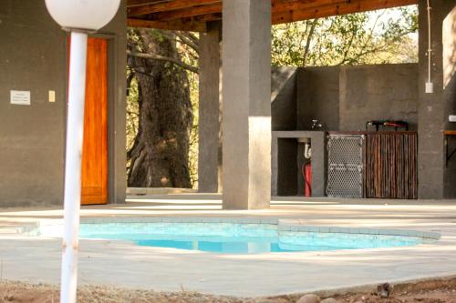 a swimming pool in the middle of a building at Bushriver Lodge in Mica