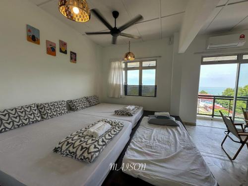 Postel nebo postele na pokoji v ubytování Laguna Seaview Suites PD By Maison