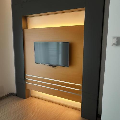 a flat screen tv hanging on a wall at 16celsius at Kea Farm Brinchang in Brinchang