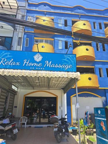 a blue building with a sign that reads relax home massage at Relax home massage Ao nang 1 in Ao Nang 