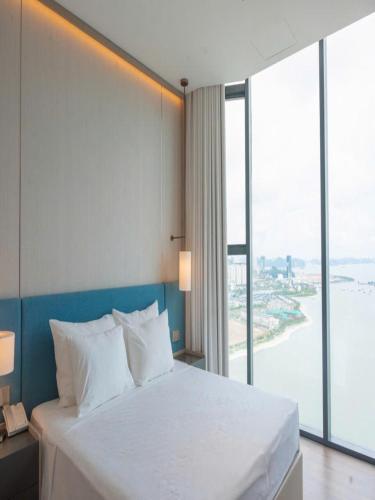 Postel nebo postele na pokoji v ubytování CHUỖI Căn hộ 2 phòng ngủ 5 Sao - View biển - Đẳng cấp đầy đủ tiện nghi - Sát BÃI BIỂN