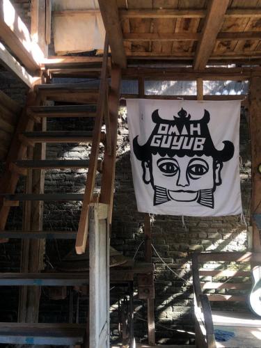 a flag hanging from the ceiling of a building at Omah Guyub in Ngabean