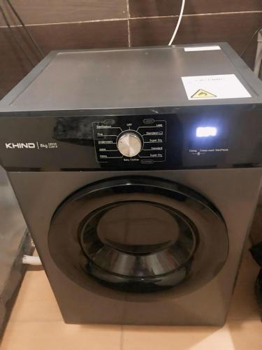 a microwave oven sitting on top of a counter at Family Room with shared Bathroom in Kuala Terengganu