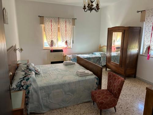 Katil atau katil-katil dalam bilik di Masseria Novelli