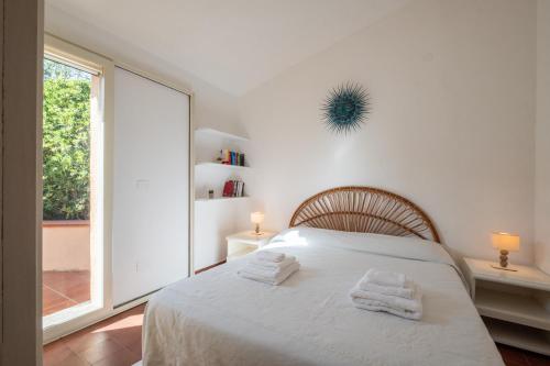Postel nebo postele na pokoji v ubytování Spiaggia&Mare a 3minuti - Villetta Vista Mare