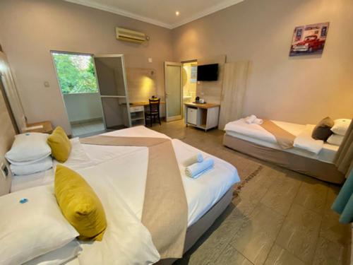 Katil atau katil-katil dalam bilik di Minen Hotel
