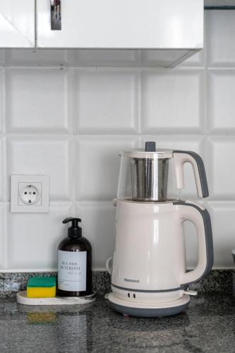 a white blender sitting on a kitchen counter at Sorta Hotel in Antalya