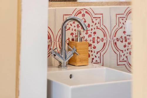 a sink with a faucet in a kitchen at Villa Polara in Modica