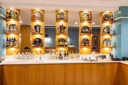 a bar with a lot of bottles on the counter at PARADISOS HOTEl in Trakhoni