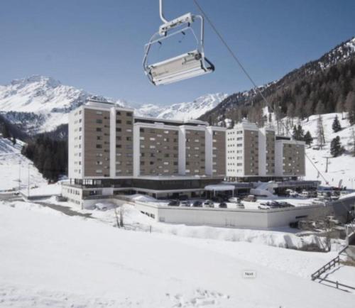 a hotel on a ski slope with a ski lift at A Quiet Place in Siviez