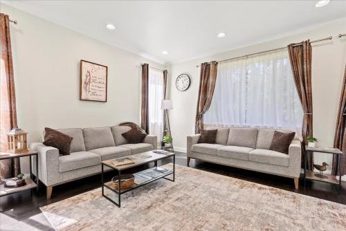a living room with two couches and a coffee table at Moose Meadow home in Anchorage